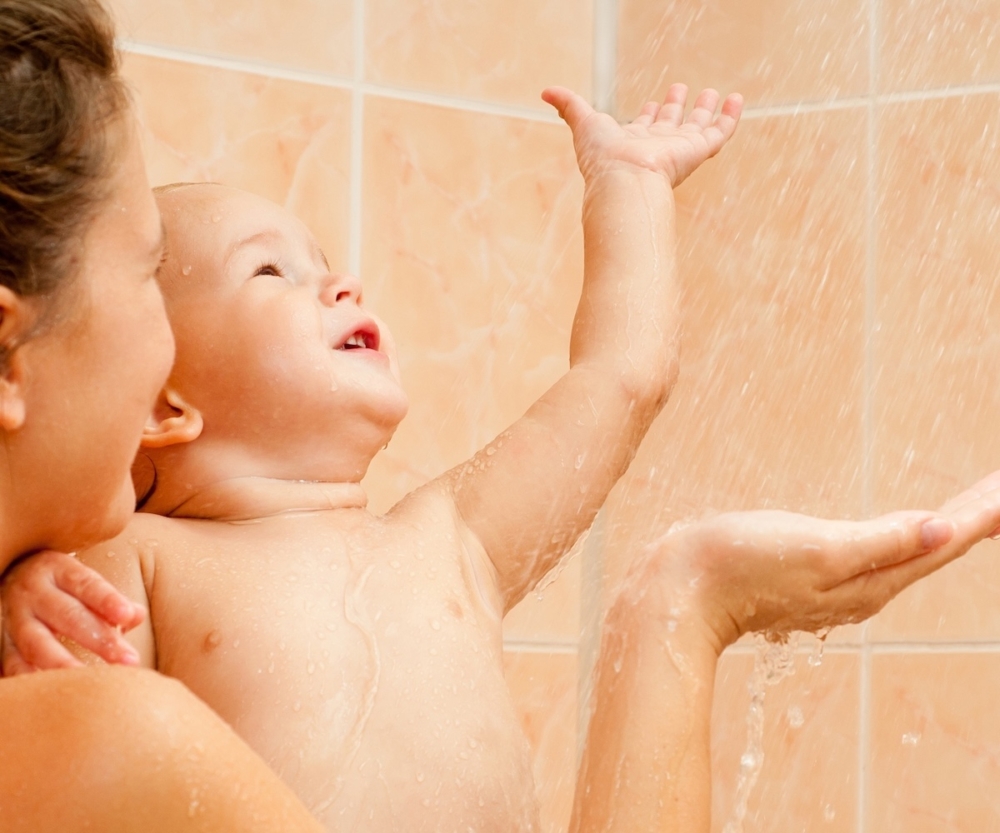 Mother and baby daughter in the shower